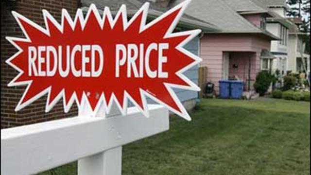 Sign indicating a reduced home price 