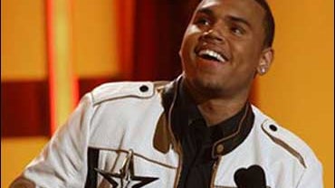 Chris Brown accepts the award for best male R&B artist at the BET awards on Tuesday June 24, 2008 in Los Angeles. 