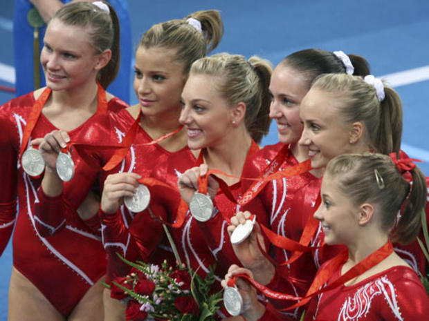 From left, U.S. gymnasts Bridget Sloan, Alicia Sacramone, Samantha Peszek, Chellsie Memmel, Nastia Liukin and Shawn Johnson display their silver medals after the women's gymnastics team finals at the Beijing Olympics on August 13, 2008. The Americans came in second place to the Chinese team. 