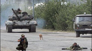Russian soldiers point their guns to the Georgian troops on the outskirts of Gori, northwest of capital Tbilisi, Georgia, Thursday, Aug. 14, 2008. 