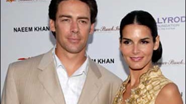 Actress Angie Harmon, right, and husband Jason Sehorn pose on the press line at the DesignCare 2007 benefit fundraiser in Malibu, Calif., July 21, 2007. 