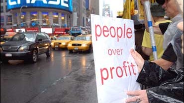 Protestors against the Wall Street Bail Out rally in New York's Times Square 