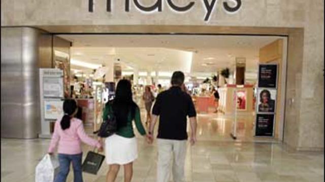A family walks into a Macy's store in San Jose, Calif. on Aug. 12, 2008. 