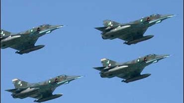 Pakistan Air Force Mirage III fighter jets fly over in formation during the Pakistan National Day parade in Islamabad 