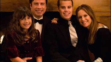 Actor John Travolta poses with his daughter Ella Bleu, wife Kelly Preston, and son Jett in an undated family photo. 