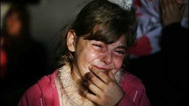 A Palestinian girl, Ayat, 10, reacts at her house after her uncle Billal Nabham, not seen, was found dead under rubble of a house, after missing for 20 days, in Beit Lahiya 