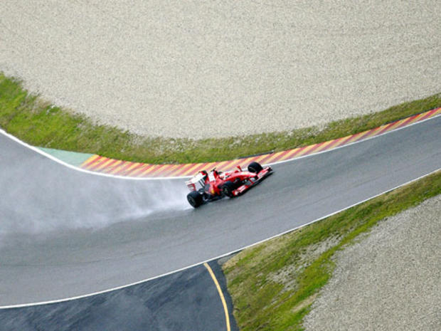 Finnish driver Kimi Raikkonen steers the new Ferrari F60 Formula One 2009 race car during a test drive on the Mugello track, central Italy, Monday, Jan. 19, 2009. 