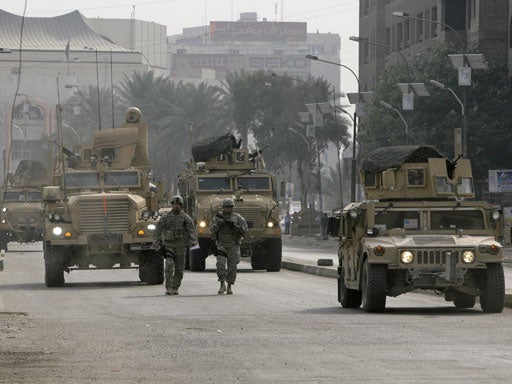 U.S. soldiers secure the area where a roadside bomb exploded in Baghdad, Iraq on Tuesday, Jan. 20, 2009. 