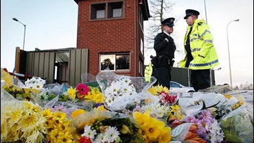 Flowers laid where soldiers killed 