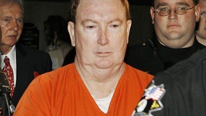 Jerome Ersland is escorted out of a courtroom by Oklahoma County sheriff deputies after a bond hearing at the Oklahoma County Courthouse in Oklahoma City Thursday, May 28, 2009. Confronted by two holdup men, pharmacist Jerome Ersland pulled a gun, shot on 