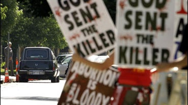 Protesters from Rev. Fred Phelps' Westboro Baptist Church demonstrate during funeral services for Dr. George Tiller Saturday, June 6, 2009, at College Hill United Methodist Church in Wichita, Kan. 