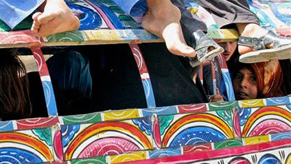 Pakistani tribal people who fled from their areas arrive in Bannu, Pakistan on Thursday, June 11, 2009. Dozens of militants attacked three army posts in a tribal region that serves as the primary base for Pakistan's Taliban chief, triggering shootouts ear 