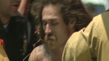 In Van Nuys, Calif., a man fled into a storm drain after allegedly robbing a warehouse. In this video, police are seen pulling the man out of the drain and placing him under arrest. 