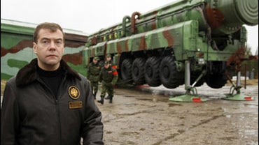 Russian President Dmitry Medvedev is seen in front of a transporter with mobile version of Topol intercontinental ballistic missile before its launch from the Plesetsk cosmodrome in northern Russia, Sunday, Oct. 12, 2008. 