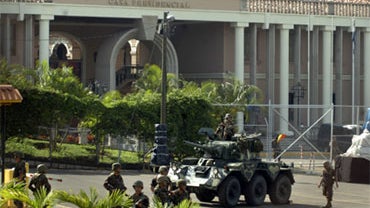 A military vehicle patrols the area around the presidential residency in Tegucigalpa, Honduras Sunday June 28, 2009. 
