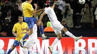 USA's Clint Dempsey, right, fails to stop Brazil's Lucio, second from left, as he goes to score a goal during their Confederations Cup final soccer match at Ellis Park Stadium in Johannesburg, South Africa, Sunday, June 28, 2009. 
