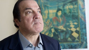 Dr. Tohme Tohme, an advisor to Michael Jackson, stands in front of a painting of Jackson titled "The Book," by artist Brett-Livingstone Strong, in the law office of Dennis Hawk in Santa Monica, Calif., on Friday, July 3, 2009. 