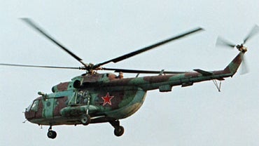 A Mi-8 helicopter flies over the Chechen capital Grozny, Russia, in this Sept. 18, 2002 file photo. 