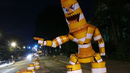 A May 31, 2009 handout photo released by Joseph Carnevale shows a sculpture made of traffic barrels by Carnevale in Raleigh, N.C.. Carnevale says he didn't have a grandiose point to make when he chopped up orange-and-white traffic barrels and turned them  
