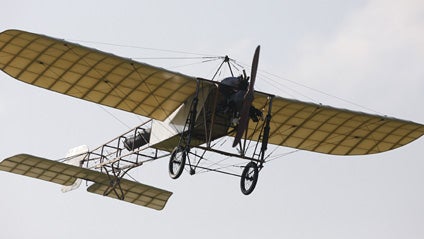 French pilot Edmond Salis flies a replica of the original Bleriot XI, ending his flight after crossing the English Channel 
