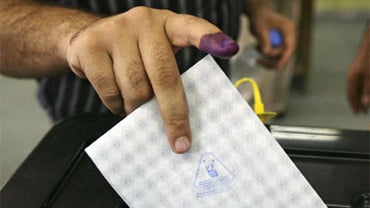 A man casts his ballot in an election for the Kurd-run region at a polling site in Baghdad, Iraq, Saturday, July 25, 2009. 