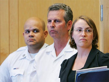 Kevin Provencher, a sports writer for the Union Leader newspaper in Manchester, NH, stands in Lawrence District Court with his attorney Jessica Thrall during his arraignment for two counts of deriving support from a prostitute in Lawrence, Mass., Wednesda 