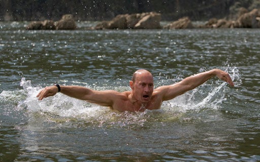 Vladimir Putin swims while traveling in the mountains 