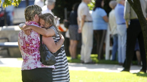 eople hug before a funeral mass outside of Our Lady of Victory Roman Catholic Church in Floral Park, NY, Thursday, July 30, 2009. The mass was for Diane Schuler, Erin Schuler, Kate Hance, Alyson Hance and Emma Hance, all of whom died in a minivan going in 