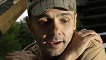 In this July 14, 2009 photo, Bernie Baran sits at his home in Woburn, Mass. Baran was recently released from prison after serving 21 years for a series of sexual attacks at a day care center in the Berkshires. A judge overturned his conviction and ordered 