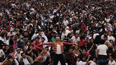Michael Jackson's impersonator Hector Jackson, performs with thousands of people at the Monument of the Revolution in Mexico City, during an attempt to break the Guinness World record of people dancing US late pop star Michael Jackson's Thriller, Saturday 