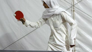 A Saudi youth plays ping pong at Rabwat Arriyadh before a religious sermon in Riyadh, Saudi Arabia, Sunday, July 12, 2009. 