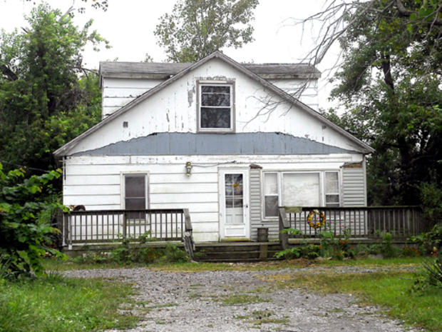 U.S. Marshalls and Illinois State Police discovered a boy who had been missing for nearly two years during a raid on this home, seen Saturday Sept. 5, 2009, in rural Franklin County, Ill. Six-year-old Richard Chekevdia was allegedly being kept in a secret 