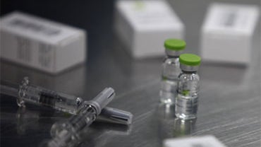 Vials of H1N1 flu vaccine by Beijing-based drug maker Sinovac Biotech Ltd. are on display at Sinovac in Beijing, China, Thursday, Sept. 3, 2009. Chinese officials approved a vaccine Thursday that they say prevents the new flu in a single dose. 