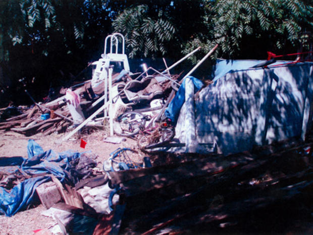 Contra Costa County building inspectors took photos as they examined the Walnut Avenue home of Phillip and Nancy Garrido, as requested by the sheriff's office, in unincorporated Antioch on August 31, 2009. Police removed about three truckloads of trash an 