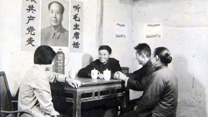 This 1960's photo released by Huaxi Village, shows communist party secretary Wu Renbao, center, visiting villager Wu Jisheng at his house in Huaxi, Jiangsu Province, China. (AP Photo/Huaxi Village) 