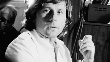 File - Movie director Roman Polanski talks with correctional officers in this Dec. 17, 1977 file photo taken at Chino Mens Institute in Chino, Calif. Polanski, who pleaded guilty to having sex with a 13-year-old girl was beginning a court ordered 90-day p 