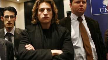 French President Nicolas Sarkozy's 21-year-old son Jean Sarkozy, center, attends a ruling party UMP meeting on his local political situation, in Paris, Tuesday Feb.12, 2008. Jean Sarkozy will not stand for mayor in a wealthy Paris suburb, the leader of th 