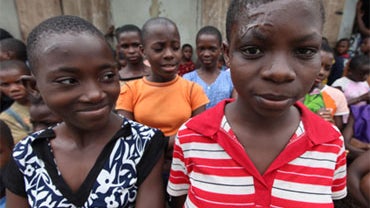 Accused child witches Jane (left) and Mary (right), standing with other children accused of witchcraft, at the Children's Rights and Rehabilitation Network in Eket, Nigeria on Aug. 18, 2009. Jane's mother tried to saw off the top of her skull after a past 