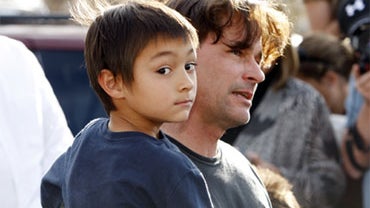 Six-year-old Falcon Heene is shown with his father, Richard, outside the family's home in Fort Collins, Colo., after Falcon Heene was found hiding in a box in a space above the garage on Thursday, Oct. 15, 2009. Falcon Heene at first had been reported to  