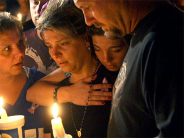 Diena Thompson, center, attends a candle-light vigil for her daughter Somer Thompson, Thursday, Oct. 22, 2009, in Orange Park, Fla. 