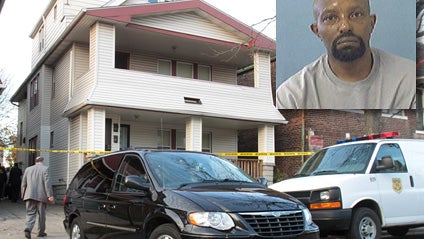 A Cuyahoga County coroner van leaves the home of Anthony Sowell (inset) on the east side of Cleveland, Oct. 30, 2009 carrying a victim discovered in the house. 