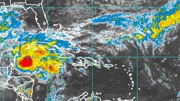Satellite imagery of Tropical Storm Ida, November 7, 2009. The U.S. National Hurricane Center in Miami said Ida's winds strengthened to near 70 mph, just short of a Category 1 hurricane. A tentative forecast track predicted Ida could brush the U.S. Gulf C 
