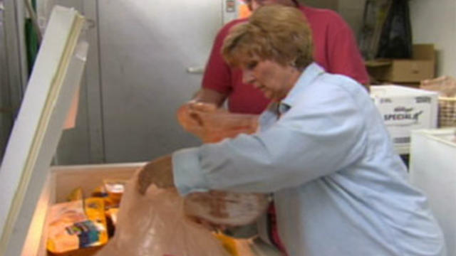 Carol and Dan Zimnie help to put away donated food in Detroit. 