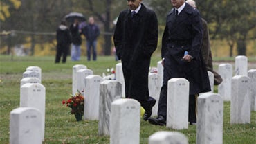 President Barack Obama and Gen. Karl Horst take part in an unannounced visit to Section 60 at Arlington National Cemetery in Arlington, Va., Wednesday, Nov. 11, 2009. 