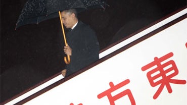 President Barack Obama walks down the stairs from Air Force One during his arrival at Pudong International Airport in Shanghai, China, Sunday, Nov. 15, 2009. 