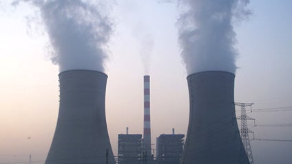 Smoke rises from cooling towers at a coal-fired power plant in Kaifeng, in central China's Henan province, Sunday, Nov. 1, 2009. climate change, global warming, greenhouse gas emissions, carbon CO2 energy electricity 