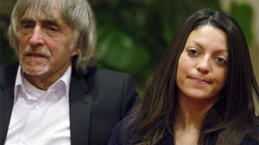 Sister of slain British student Meredith Kercher, Stephanie, right, shares a word with her father John. The parents and sister of Meredith Kercher, slain last year in Perugia, have read a statement to the press on Monday, on the eve of a closed-door preli 