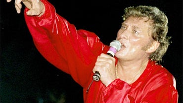 French rock star Johnny Hallyday performs during his 50th birthday concert at the Parc des Princes stadium in Paris, in this June 15, 1993 photo. 