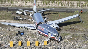 An aerial view of the cracked fuselage of American Airlines flight AA331, which crashed landed overnight on a flight from Miami to Jamaica, just beyond the runway of Norman Manley international airport in Kingston, Wednesday, Dec. 23, 2009. 