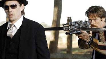 As the "cured" vampire, Elvis, actor Willem Dafoe (right) stars alongisde Ethan Hawke (left) in the new science fiction film, "Daybreakers."  Dafoe says Twilight comparisons should be avoided. 